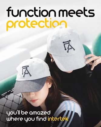 Two women wearing baseball caps