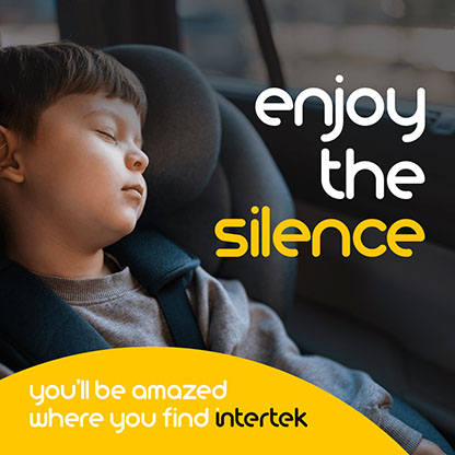 A young boy sleeping in a car seat