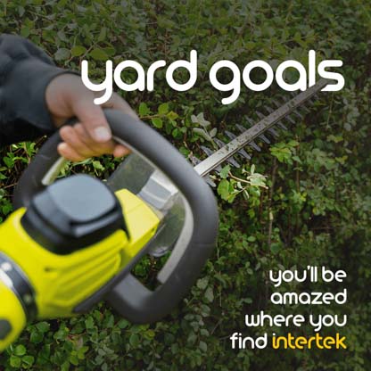 A handheld trimmer being used in the yard
